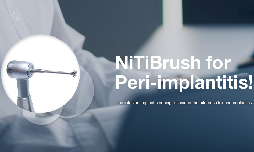 NiTiBrush for Peri-implantitis mounted on an implant handpiece